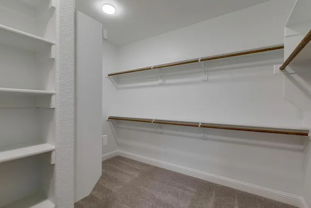 a bathroom with a granite countertop sink mirror and bathtub