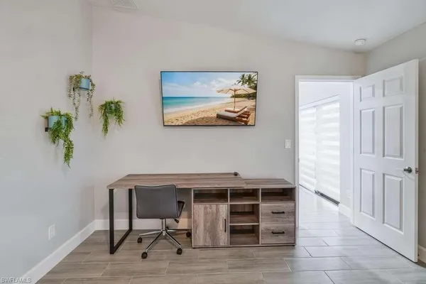a view of a workspace with furniture