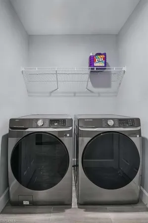 a utility room with dryer and washer