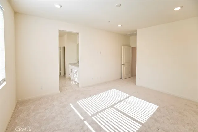a spacious bathroom with a double vanity sink mirror and double