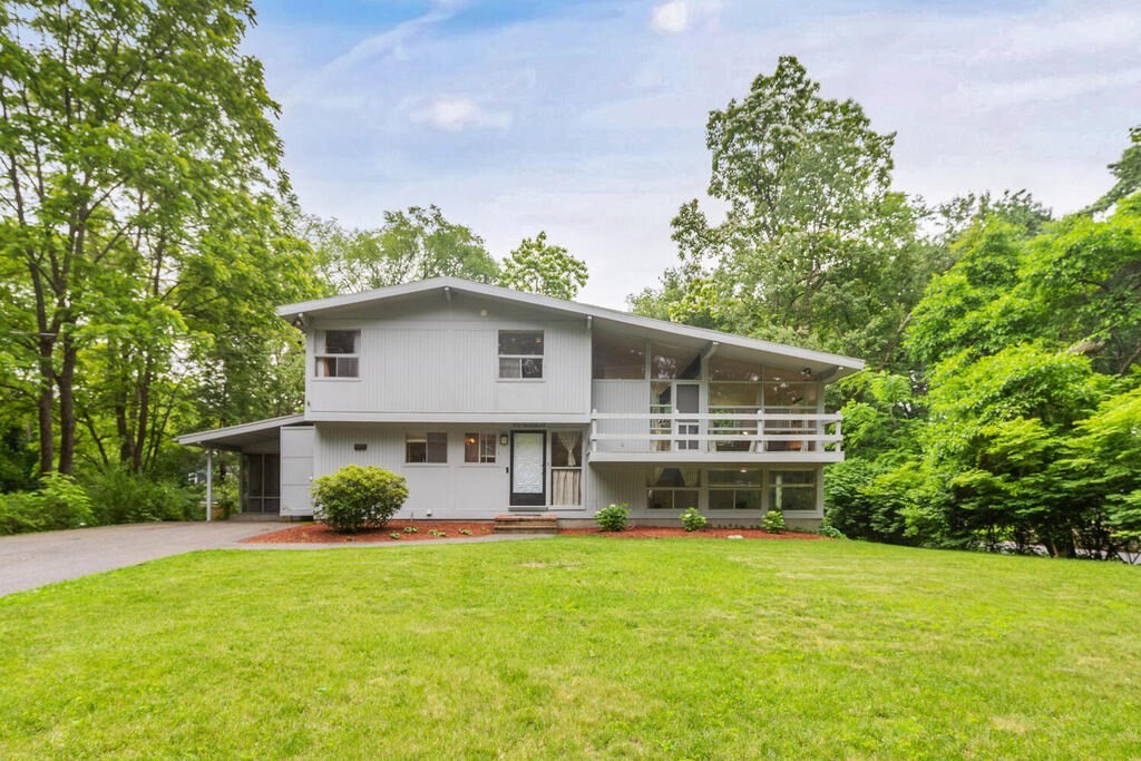 a front view of a house with garden