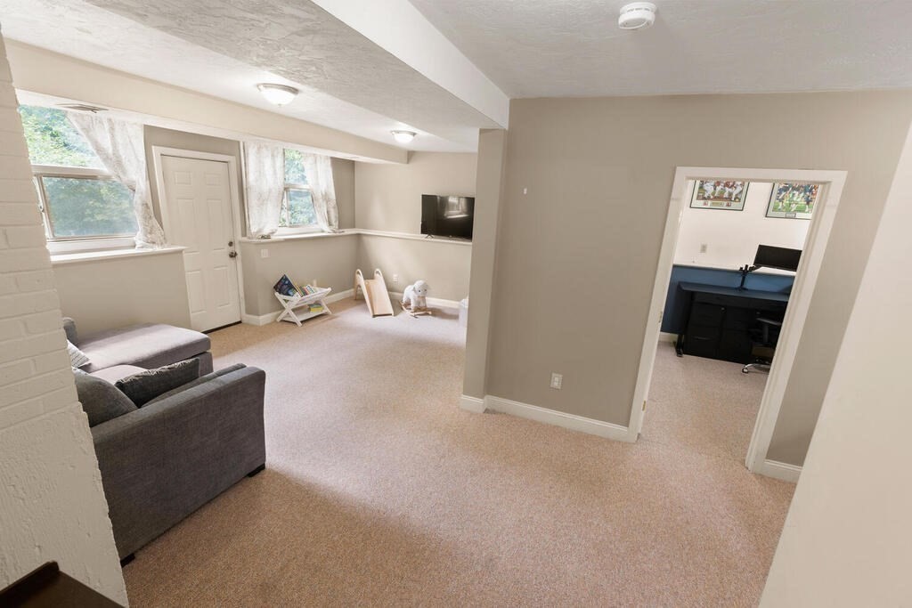 459 Winch Street Framingham, MA 01701 - Photo 12 of 34 a living room with furniture and a flat screen tv