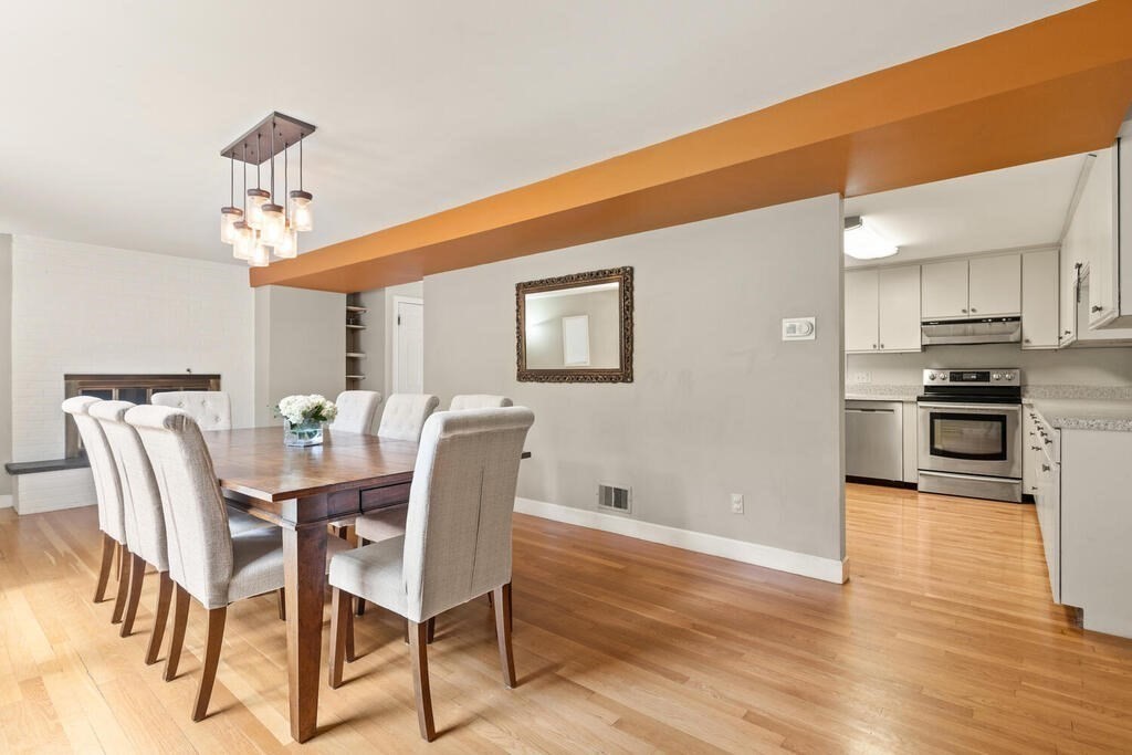 459 Winch Street Framingham, MA 01701 - Photo 16 of 34 a view of a dining room with furniture and wooden floor