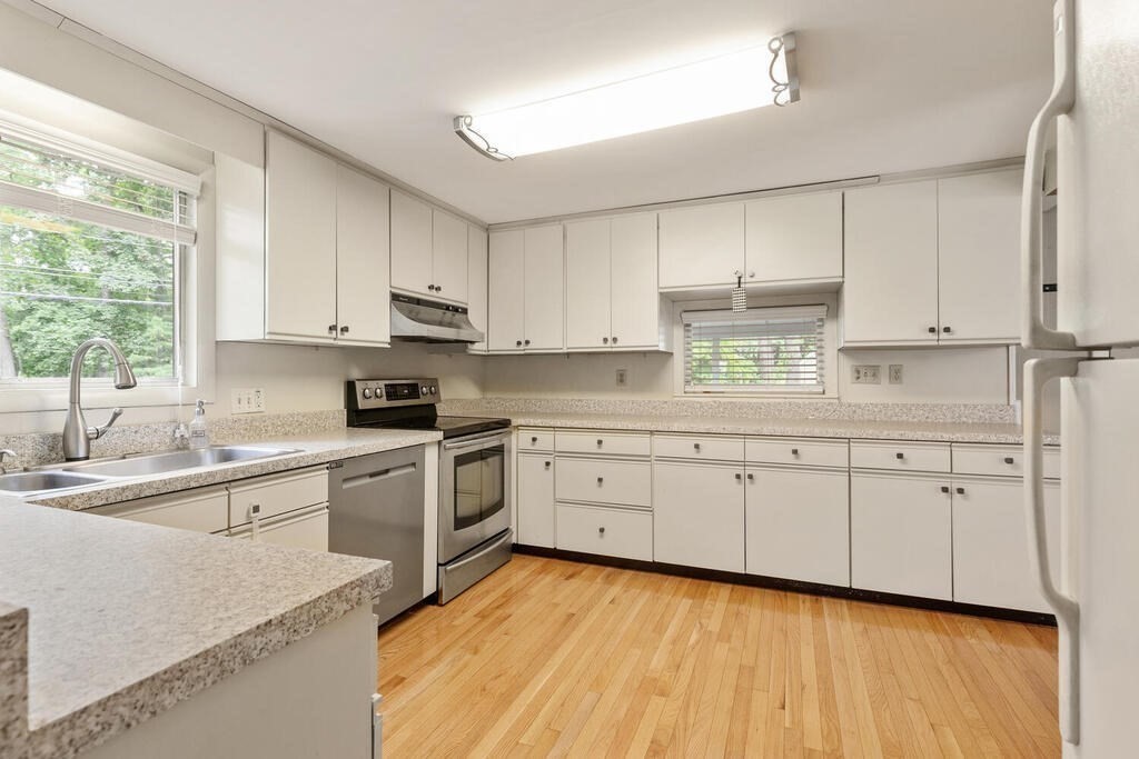 459 Winch Street Framingham, MA 01701 - Photo 19 of 34 a kitchen with cabinets appliances a sink and a window