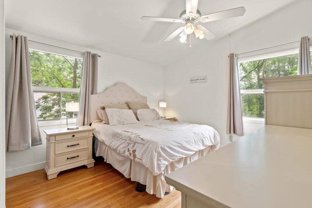 459 Winch Street Framingham, MA 01701 - Photo 23 of 34 a bedroom with a bed and a chandelier