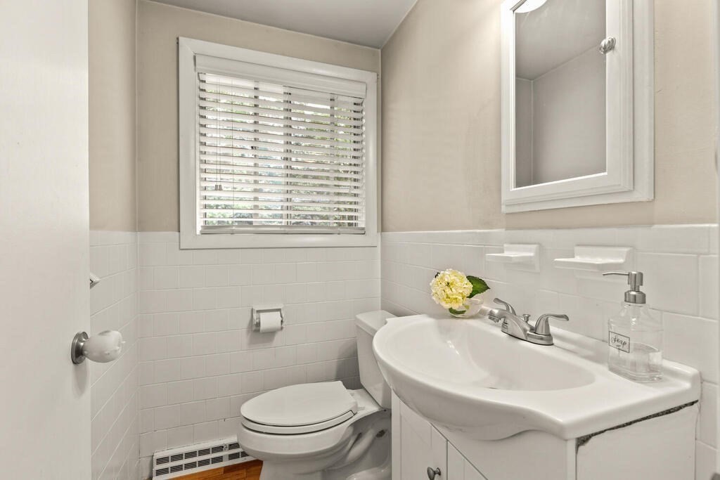 459 Winch Street Framingham, MA 01701 - Photo 24 of 34 a bathroom with a sink a toilet and a window