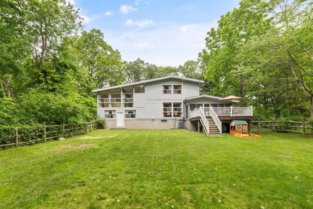 459 Winch Street Framingham, MA 01701 - Photo 30 of 34 a view of a house with a big yard and sitting area