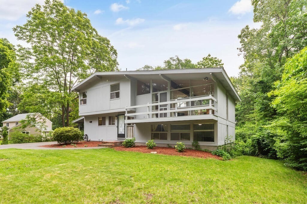 459 Winch Street Framingham, MA 01701 - Photo 3 of 34 a view of a house with a yard
