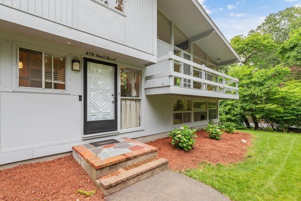 459 Winch Street Framingham, MA 01701 - Photo 4 of 34 a front view of a house with garden
