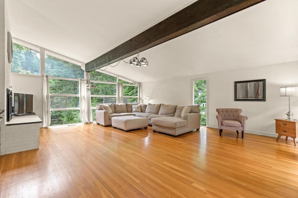 459 Winch Street Framingham, MA 01701 - Photo 6 of 34 a living room with furniture and a large window