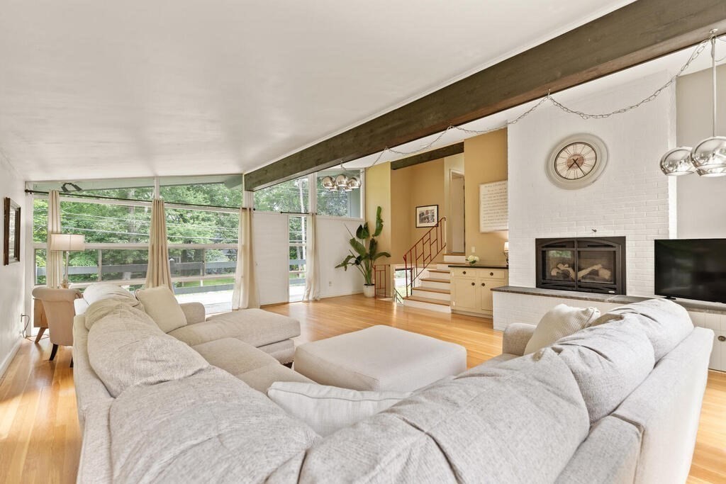 459 Winch Street Framingham, MA 01701 - Photo 8 of 34 a living room with furniture large window and a fireplace