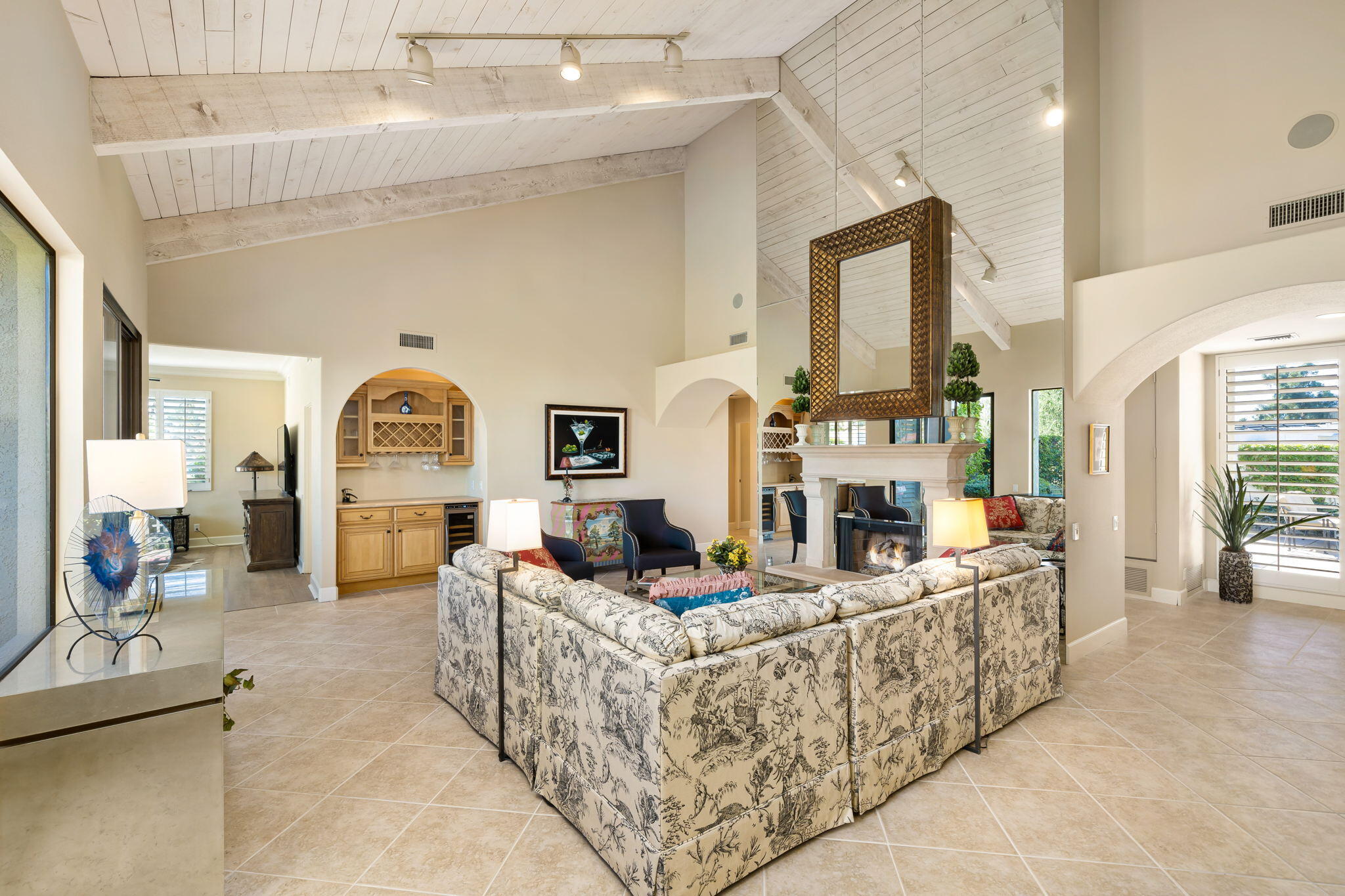 818 Inverness Drive Rancho Mirage, CA 92270 - Photo 11 of 43 a living room with fireplace furniture and a large window