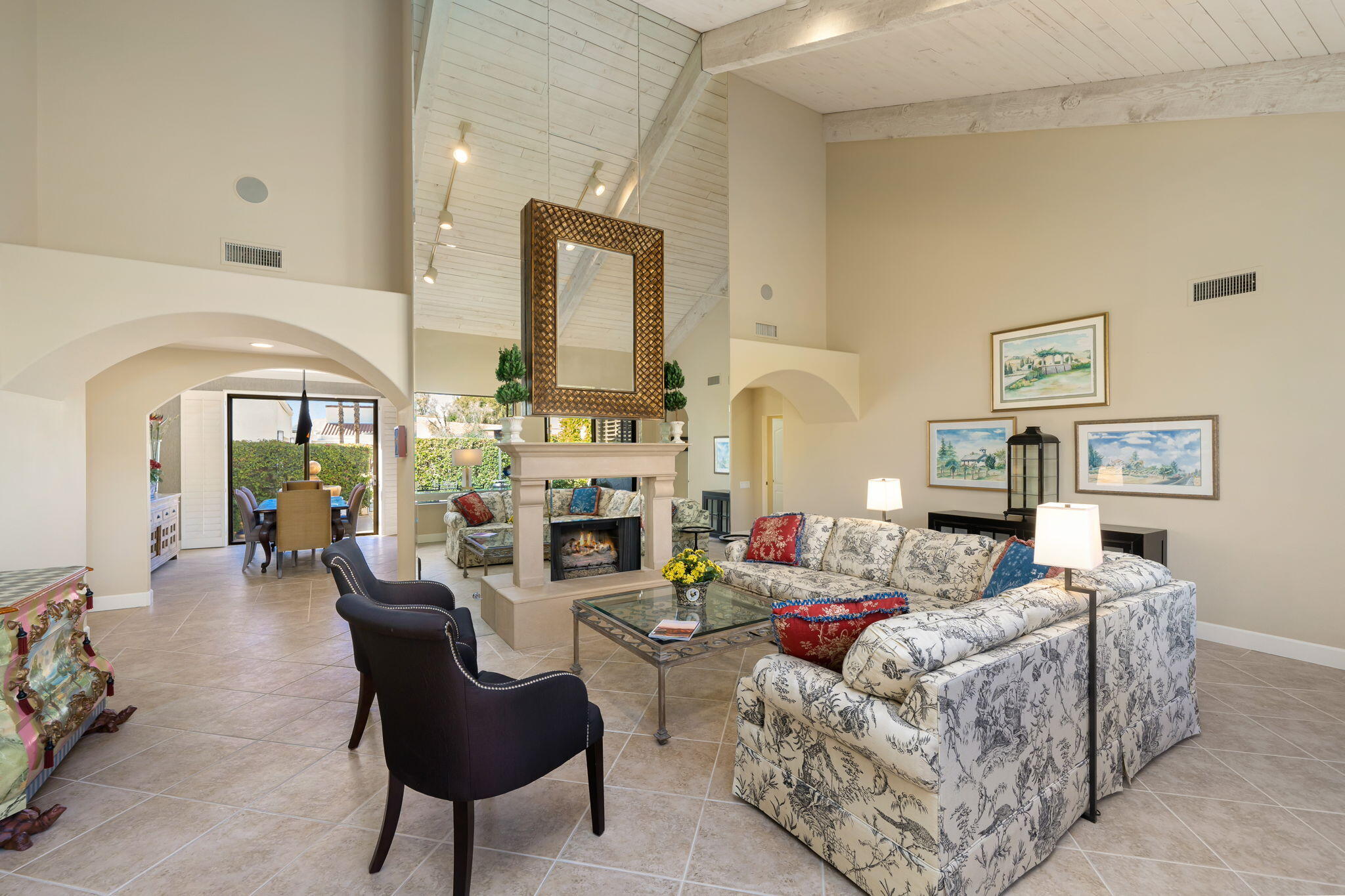 818 Inverness Drive Rancho Mirage, CA 92270 - Photo 14 of 43 a living room with furniture a fireplace and a large mirror