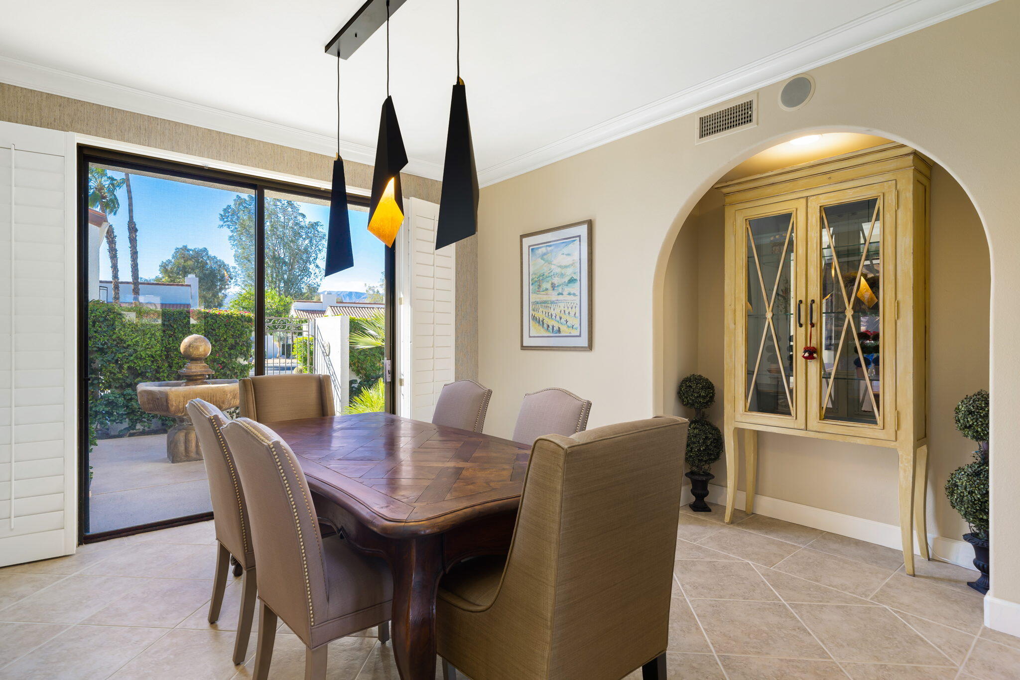 818 Inverness Drive Rancho Mirage, CA 92270 - Photo 18 of 43 a dining room with furniture a chandelier and wooden floor