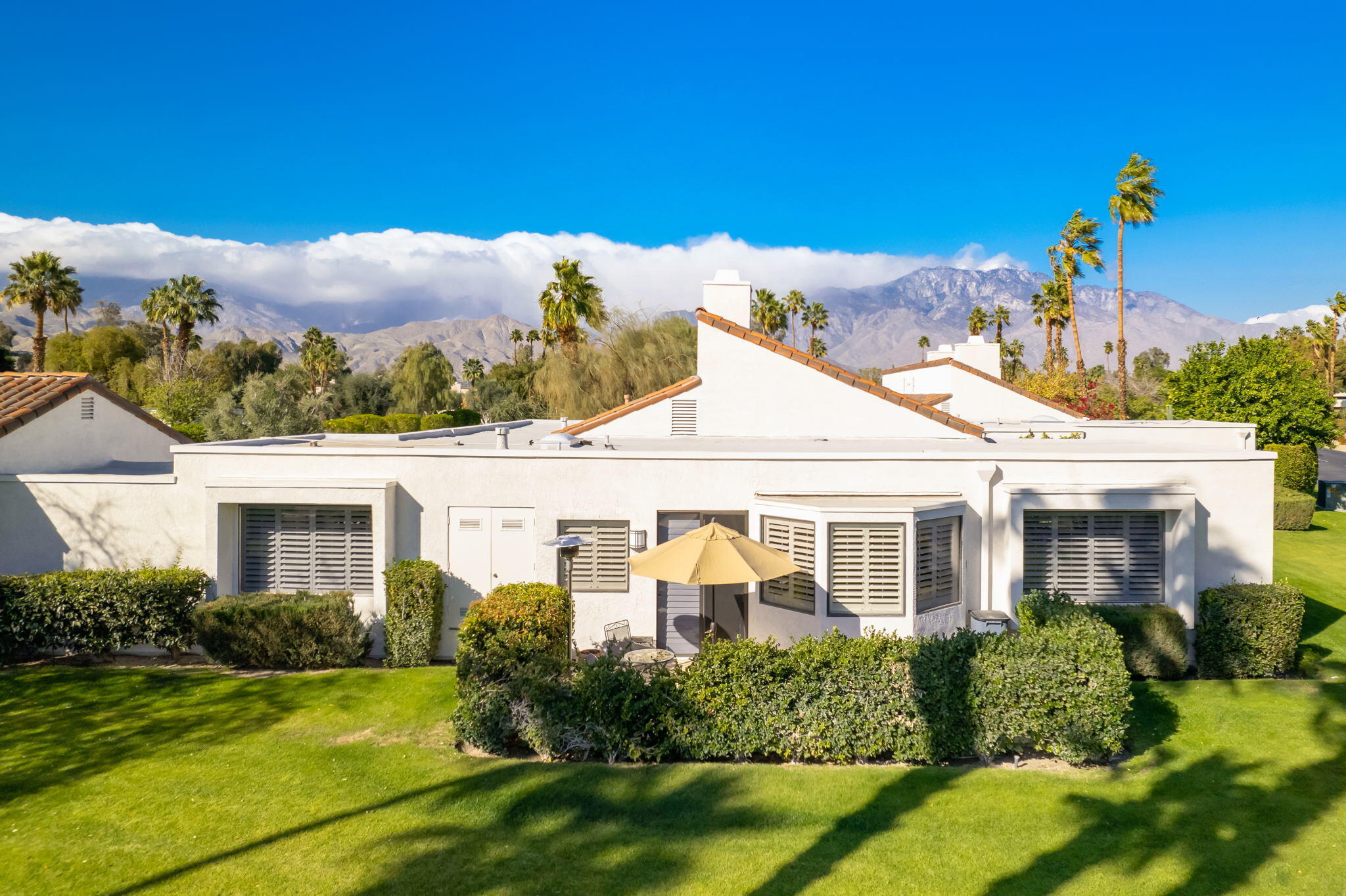 818 Inverness Drive Rancho Mirage, CA 92270 - Photo 2 of 43 a front view of a house with a yard