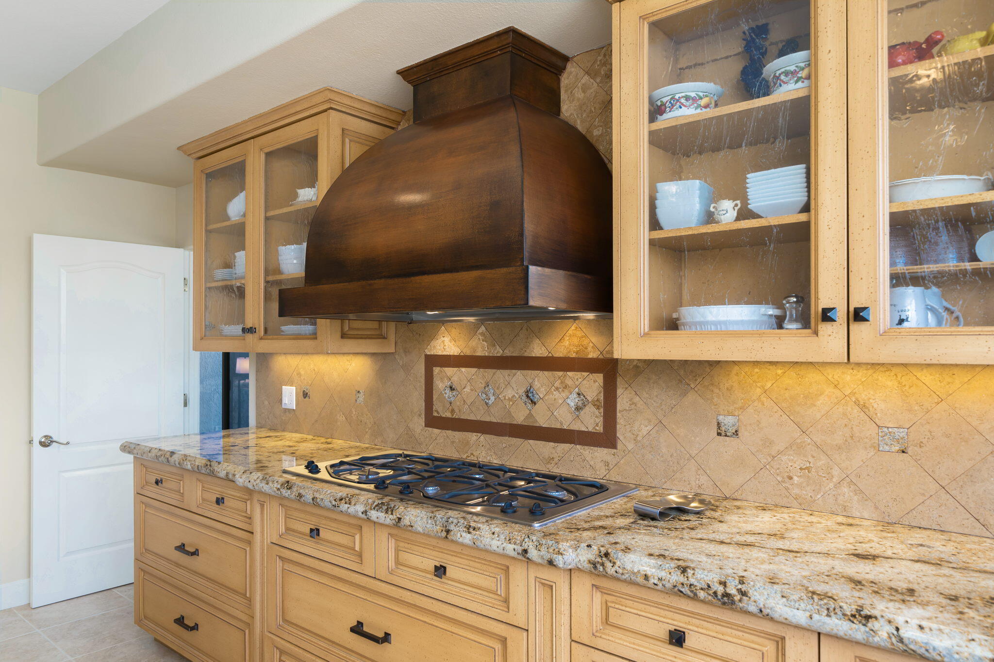 818 Inverness Drive Rancho Mirage, CA 92270 - Photo 23 of 43 a kitchen with granite countertop a stove and a sink