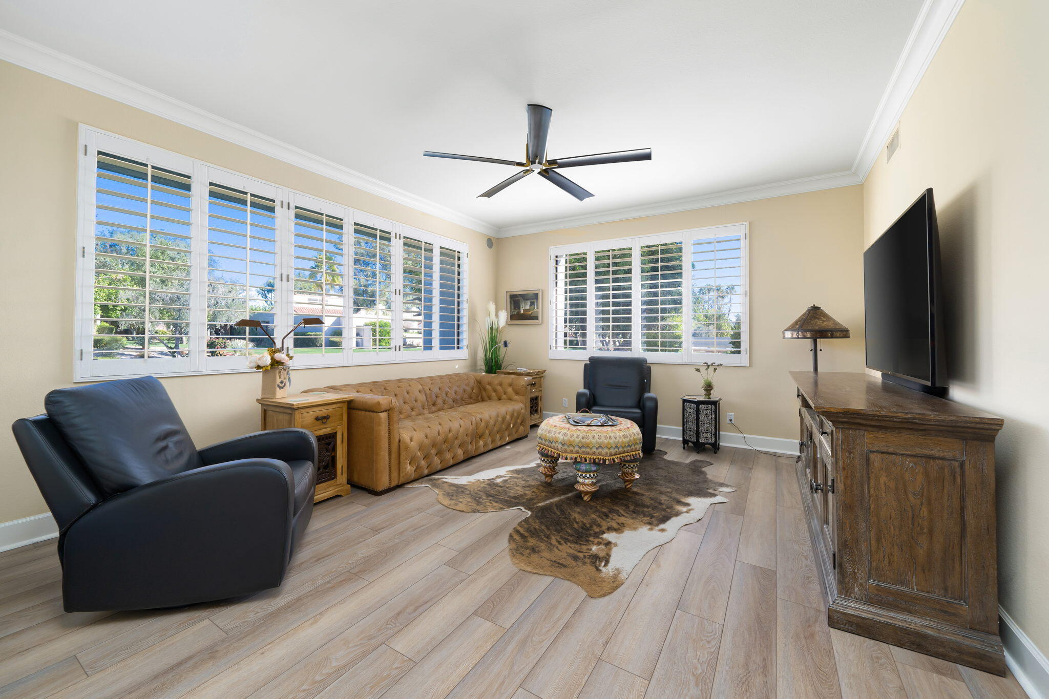 818 Inverness Drive Rancho Mirage, CA 92270 - Photo 24 of 43 a living room with furniture flat screen tv and a large window