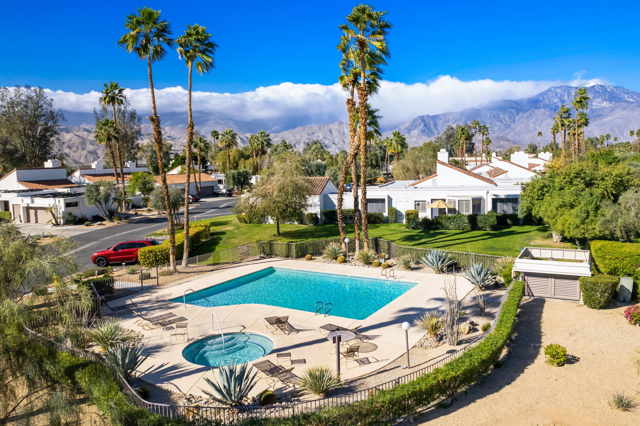 818 Inverness Drive Rancho Mirage, CA 92270 - Photo 3 of 43 a view of a swimming pool with a patio and a yard