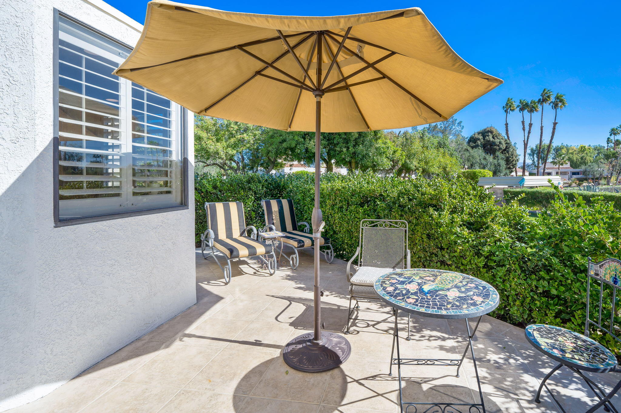 818 Inverness Drive Rancho Mirage, CA 92270 - Photo 38 of 43 a view of backyard with seating space and plants