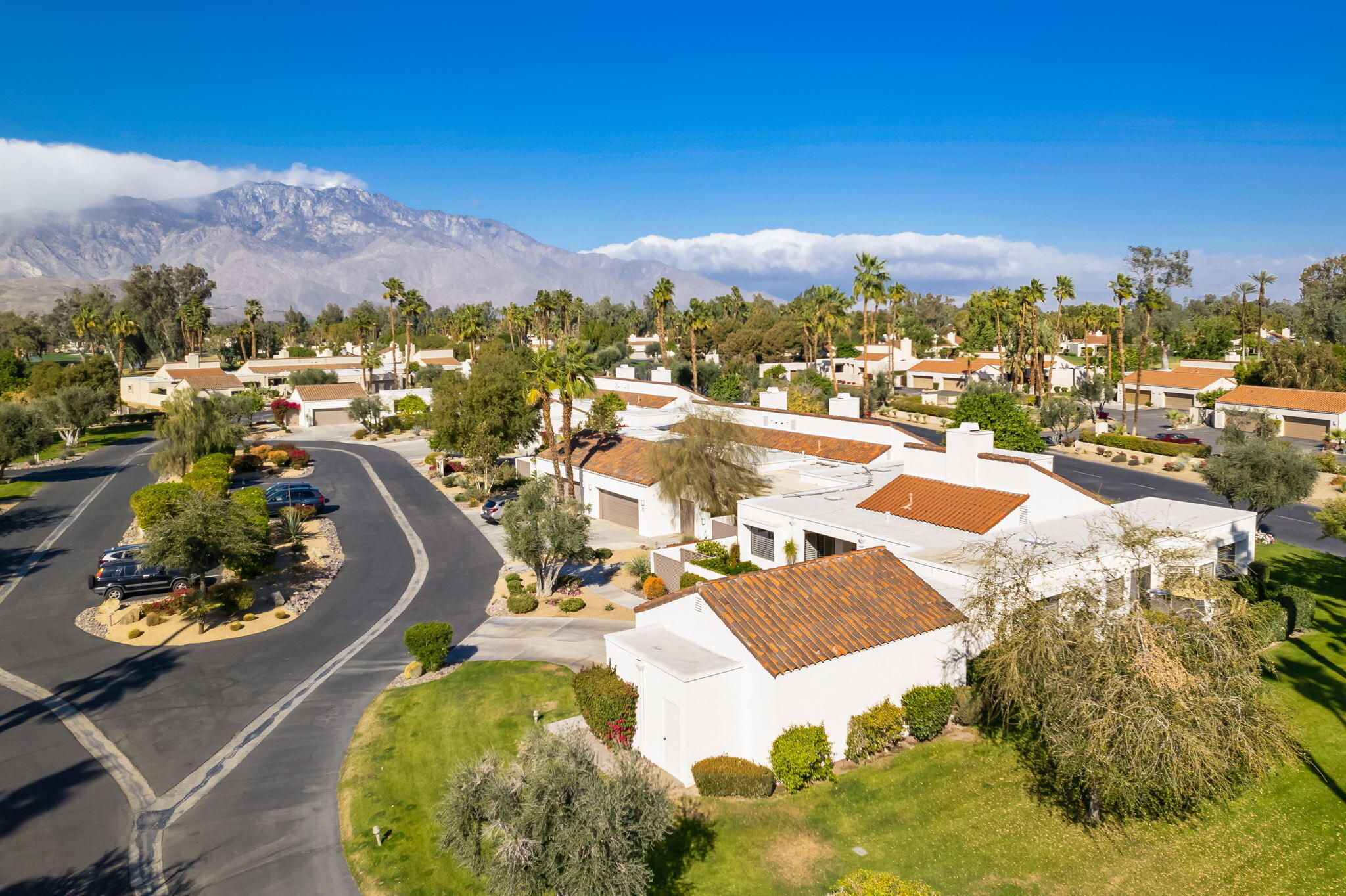 818 Inverness Drive Rancho Mirage, CA 92270 - Photo 4 of 43 a view of a swimming pool with a lake view