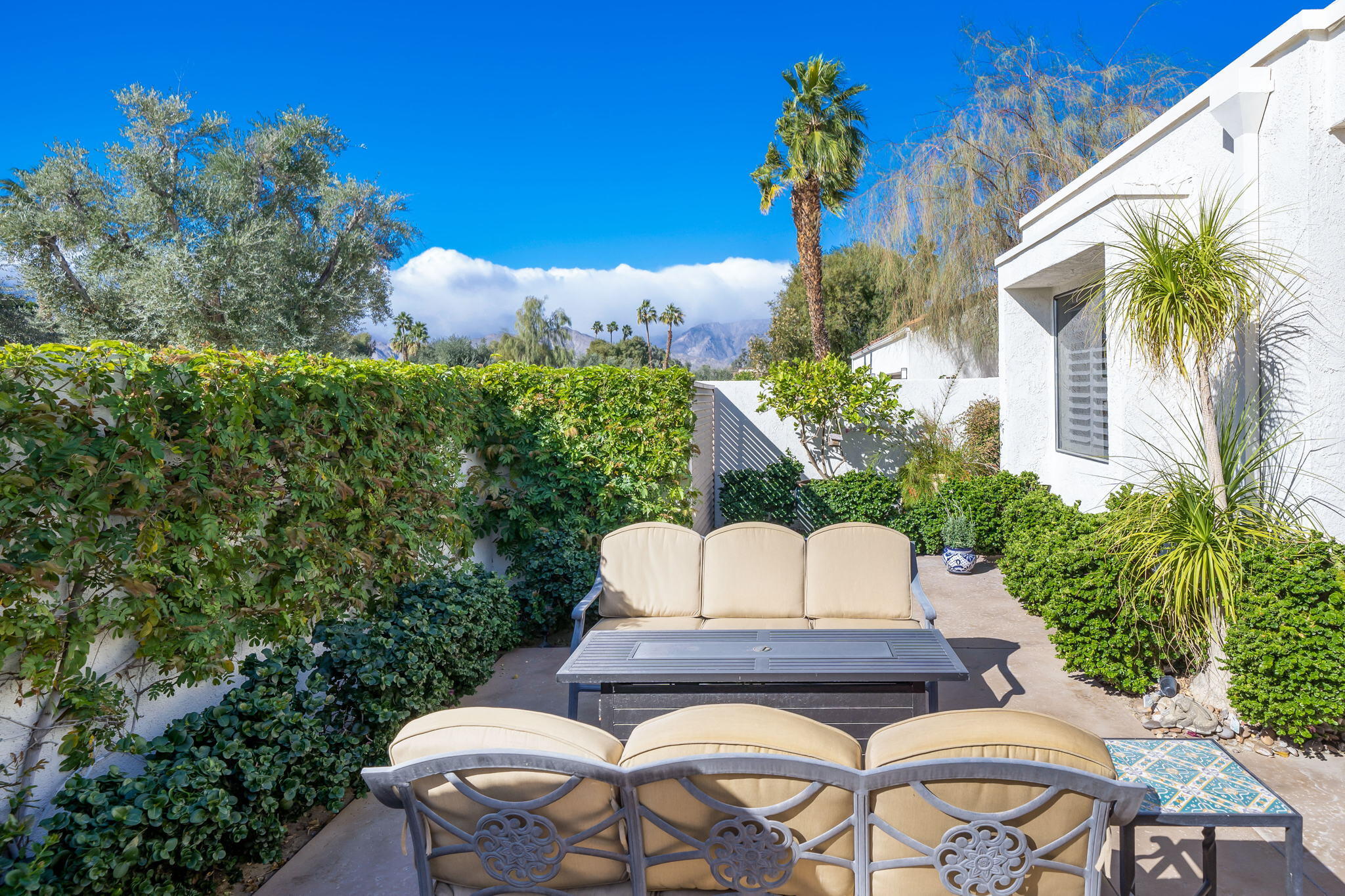 818 Inverness Drive Rancho Mirage, CA 92270 - Photo 42 of 43 a view of a chairs and table in the backyard
