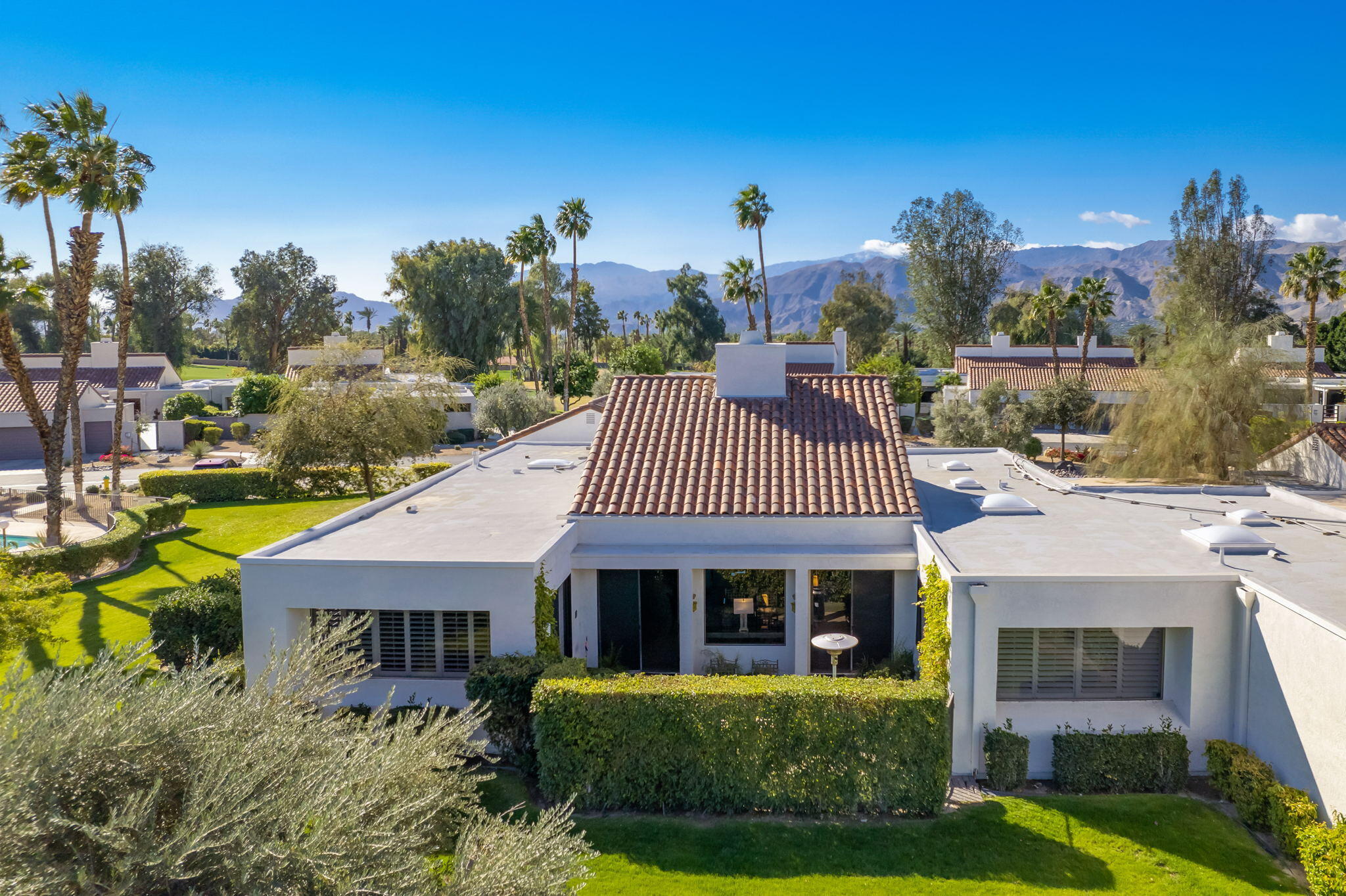 818 Inverness Drive Rancho Mirage, CA 92270 - Photo 5 of 43 a front view of a house with garden