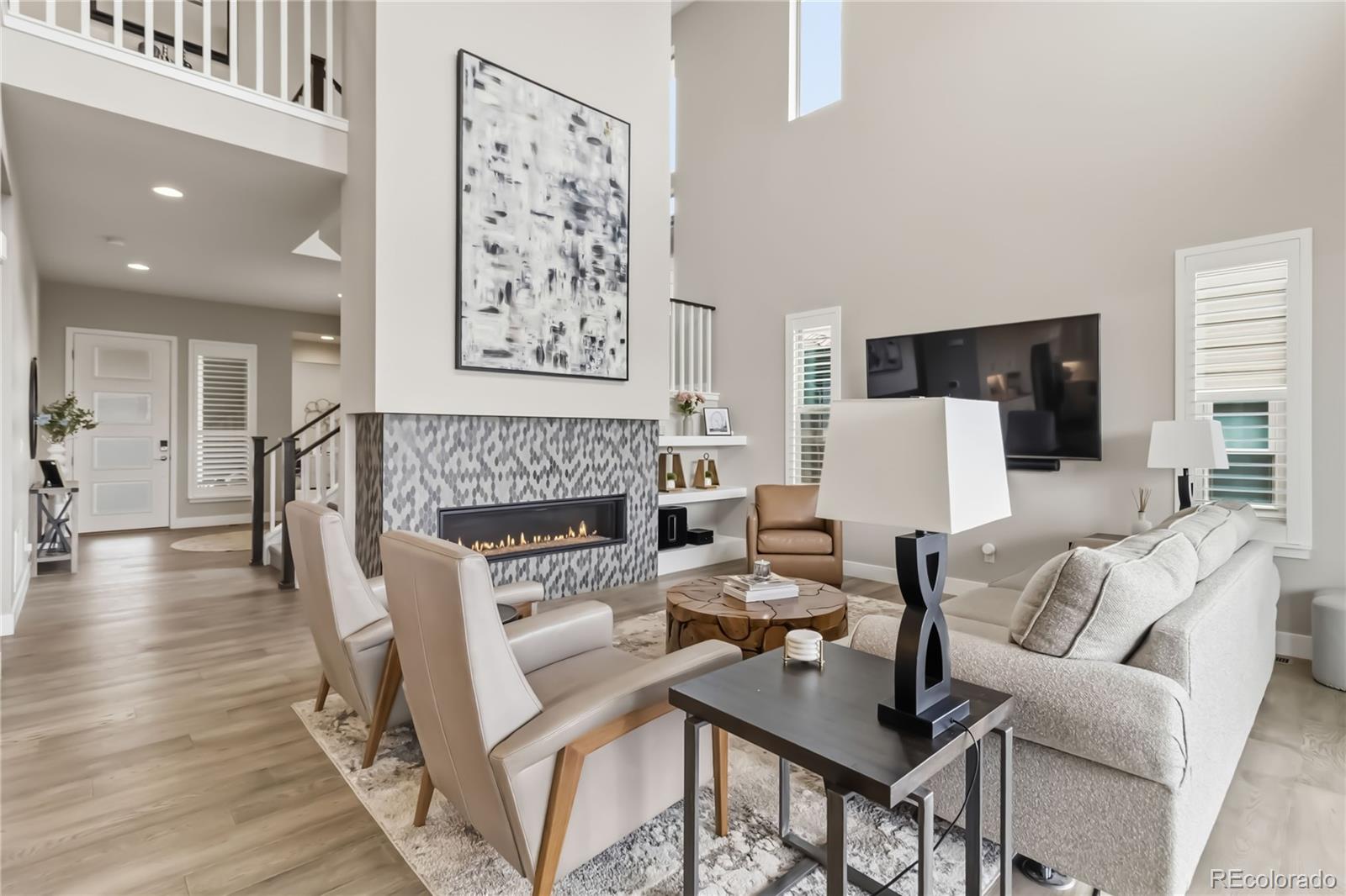 489 Meadowleaf Lane Highlands Ranch, CO 80126 - Photo 11 of 50 a living room with furniture and a fireplace