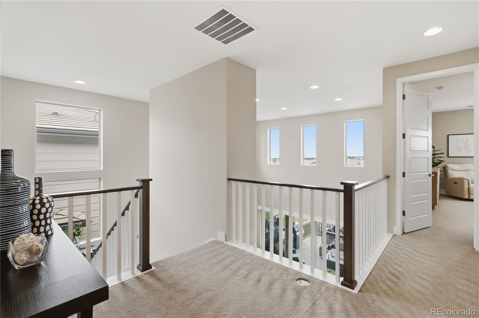 489 Meadowleaf Lane Highlands Ranch, CO 80126 - Photo 21 of 50 a view of a hallway with seating area