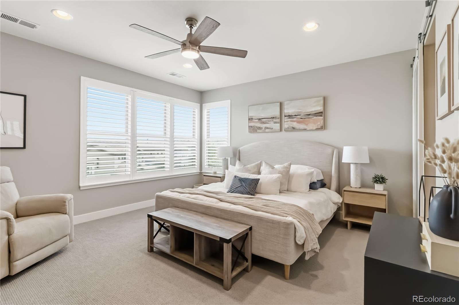 489 Meadowleaf Lane Highlands Ranch, CO 80126 - Photo 24 of 50 a bedroom with a bed a couch and a large window