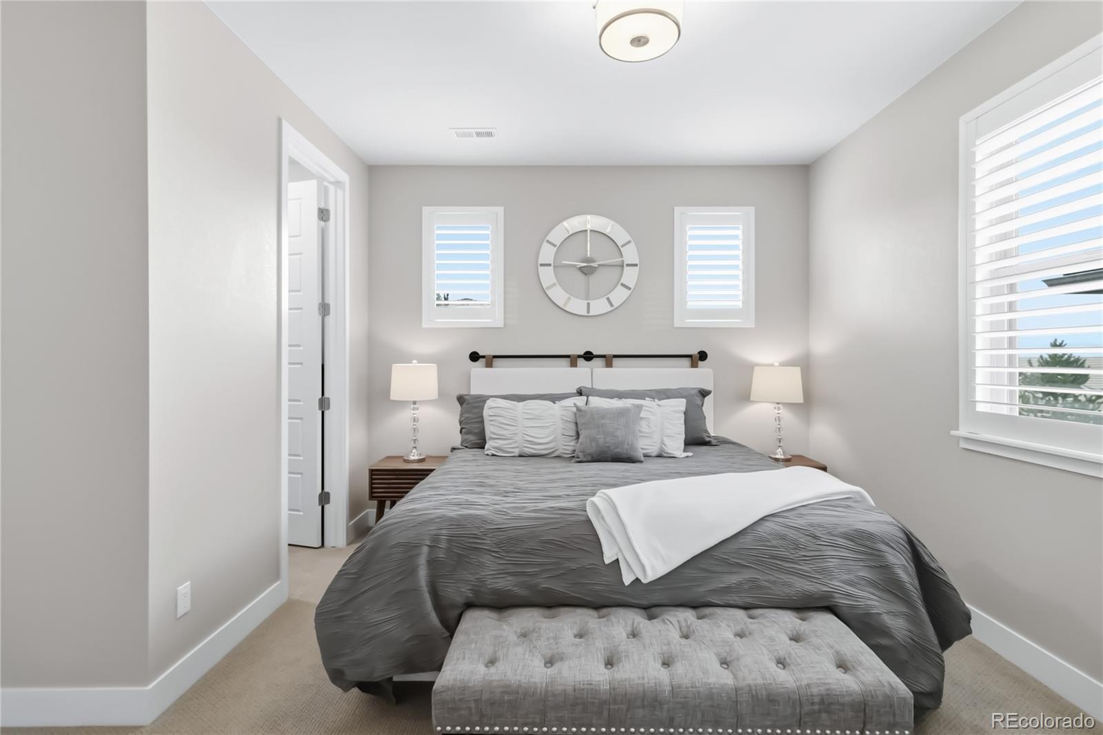 489 Meadowleaf Lane Highlands Ranch, CO 80126 - Photo 32 of 50 a bedroom with a large bed and a window