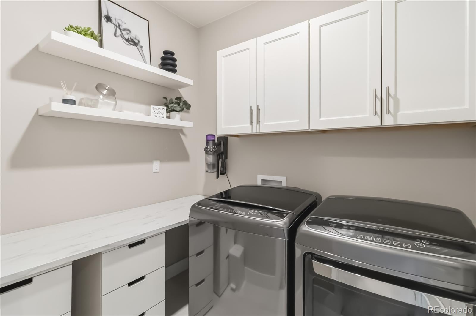 489 Meadowleaf Lane Highlands Ranch, CO 80126 - Photo 35 of 50 a utility room with washer and dryer