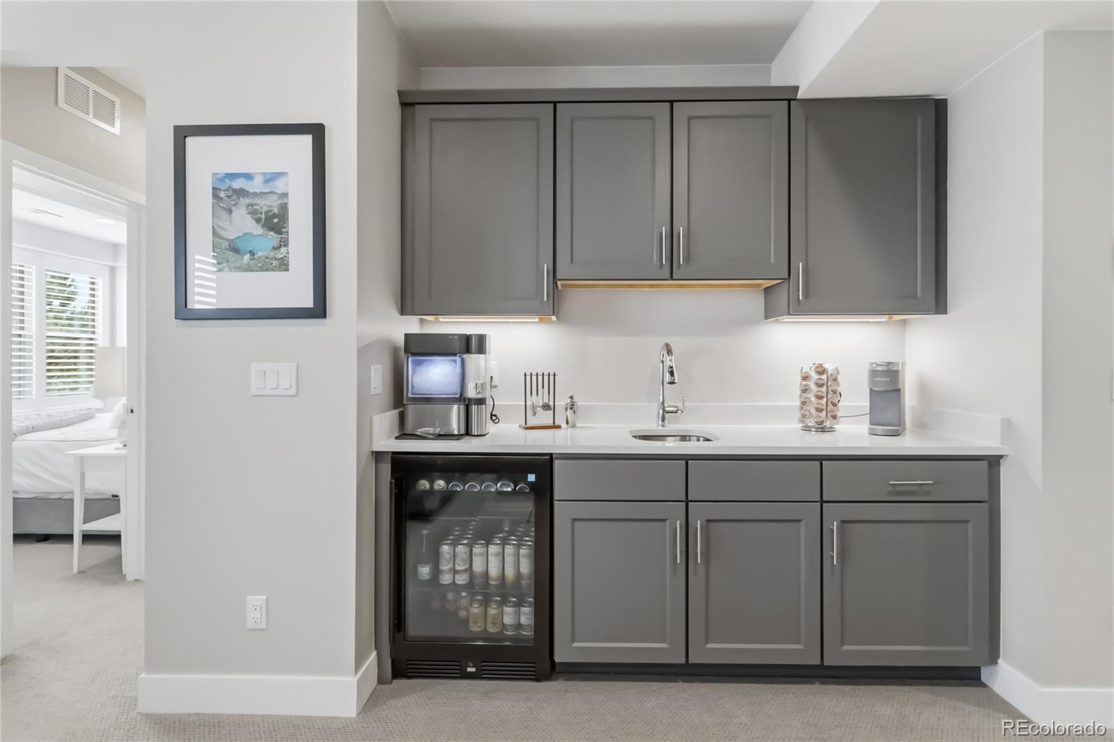 489 Meadowleaf Lane Highlands Ranch, CO 80126 - Photo 38 of 50 a kitchen with stainless steel appliances granite countertop a sink and cabinets with wooden floor