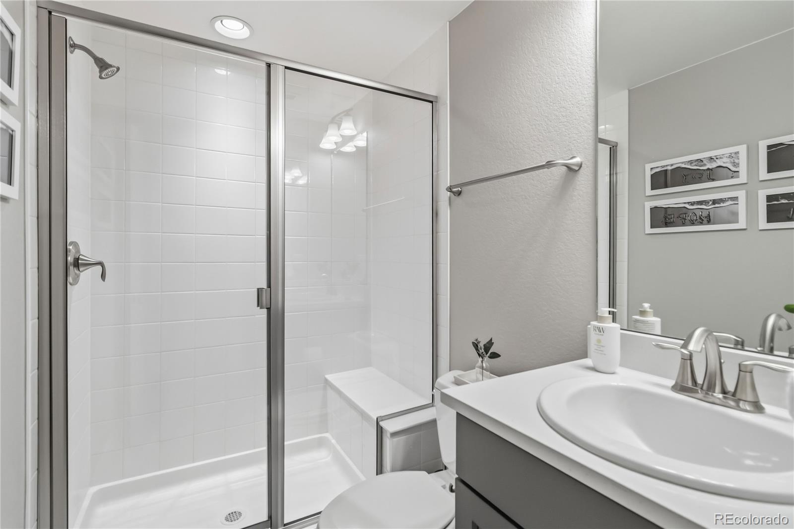 489 Meadowleaf Lane Highlands Ranch, CO 80126 - Photo 40 of 50 a bathroom with a sink and a mirror
