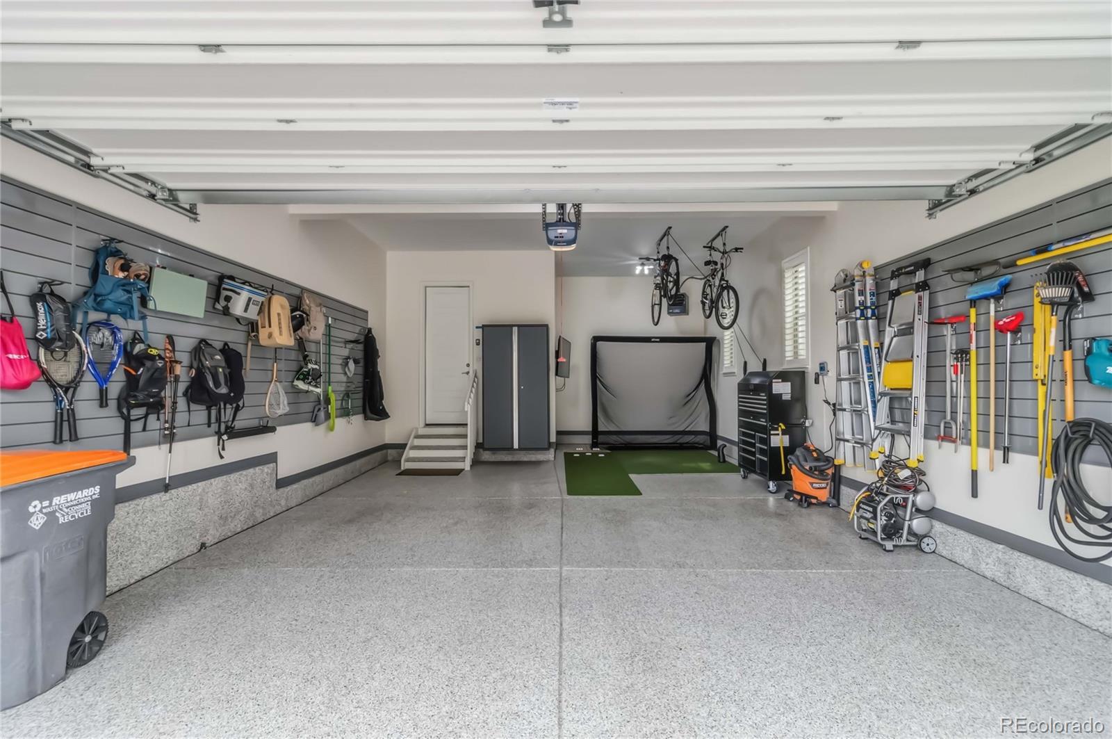 489 Meadowleaf Lane Highlands Ranch, CO 80126 - Photo 43 of 50 a view of a garage with rack and bicycle