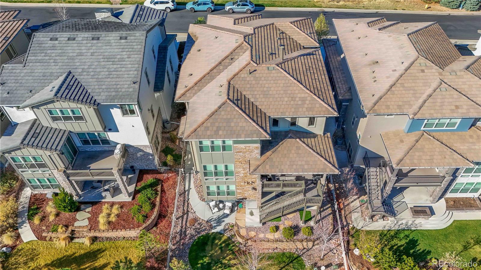 489 Meadowleaf Lane Highlands Ranch, CO 80126 - Photo 6 of 50 an aerial view of a house with swimming pool and patio
