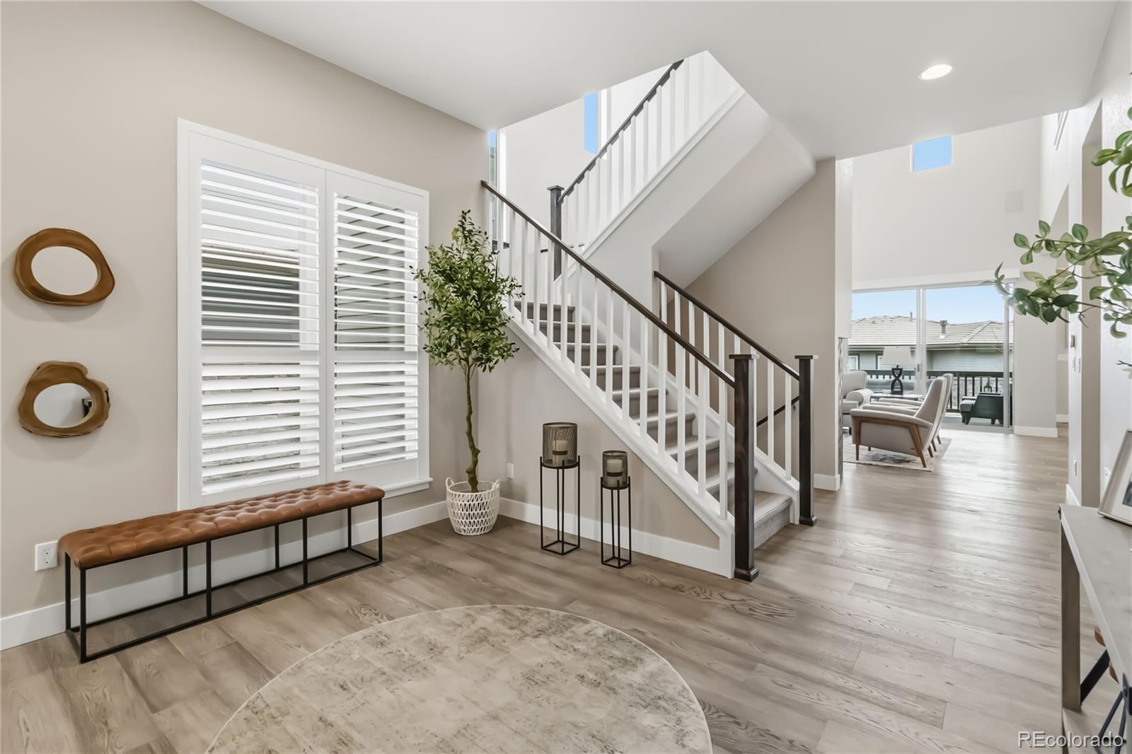 489 Meadowleaf Lane Highlands Ranch, CO 80126 - Photo 8 of 50 a view of entryway and hall with wooden floor