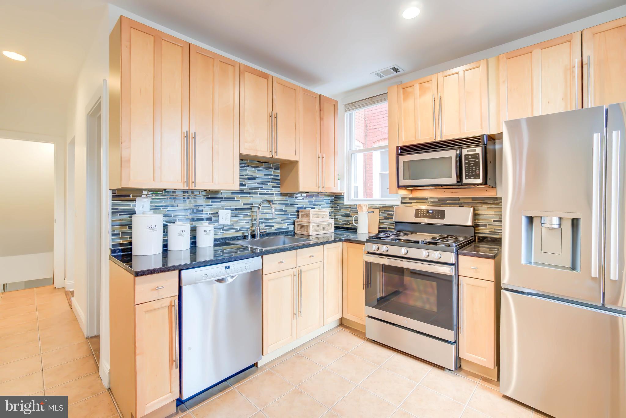 1111 Fairmont Street Northwest Washington, DC 20009 - Photo 12 of 55 Kitchen w Gas Cooking & Fridge w Craft Ice Maker
