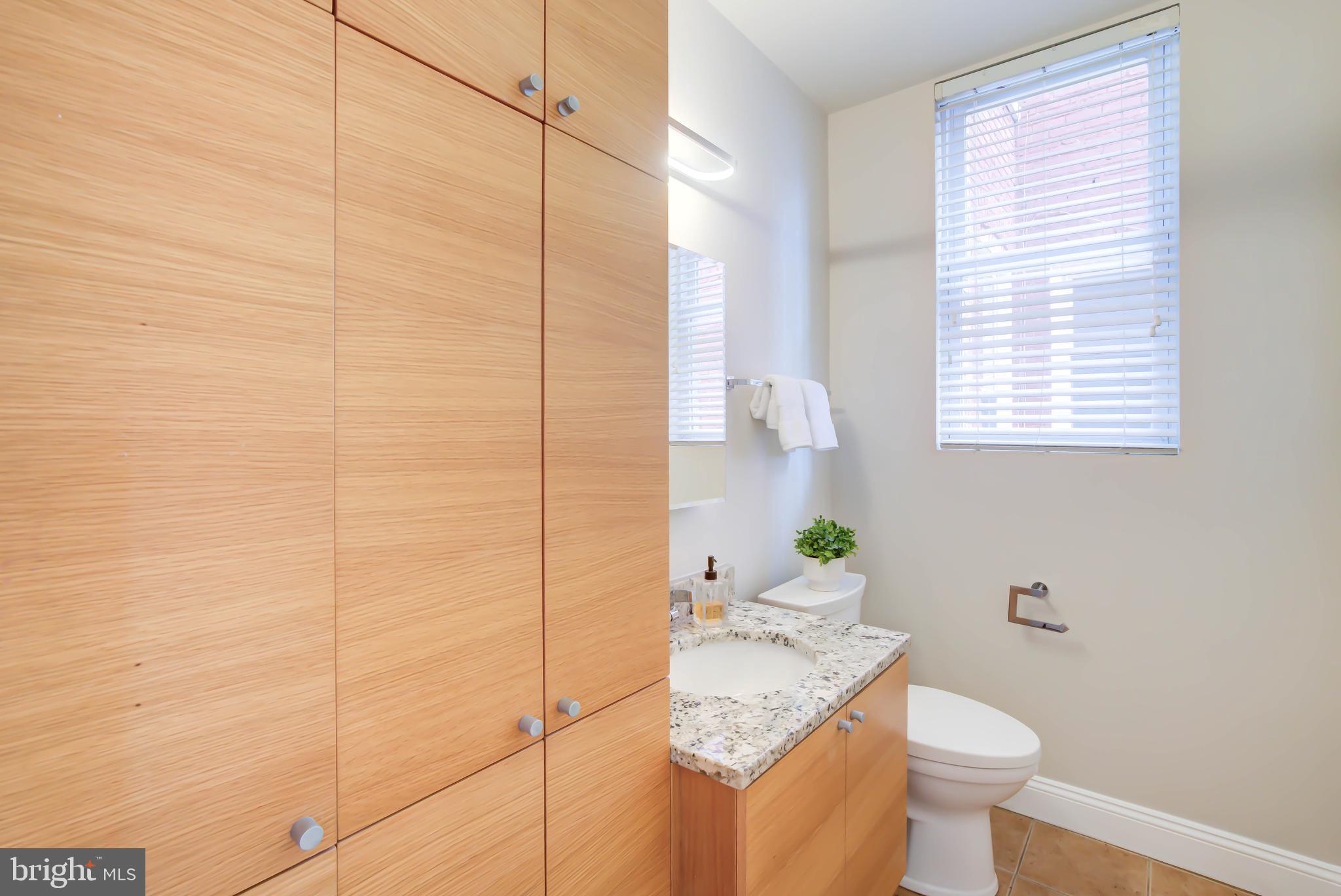 1111 Fairmont Street Northwest Washington, DC 20009 - Photo 18 of 55 Convenient Main Level Powder w Add'l W/D Hookup