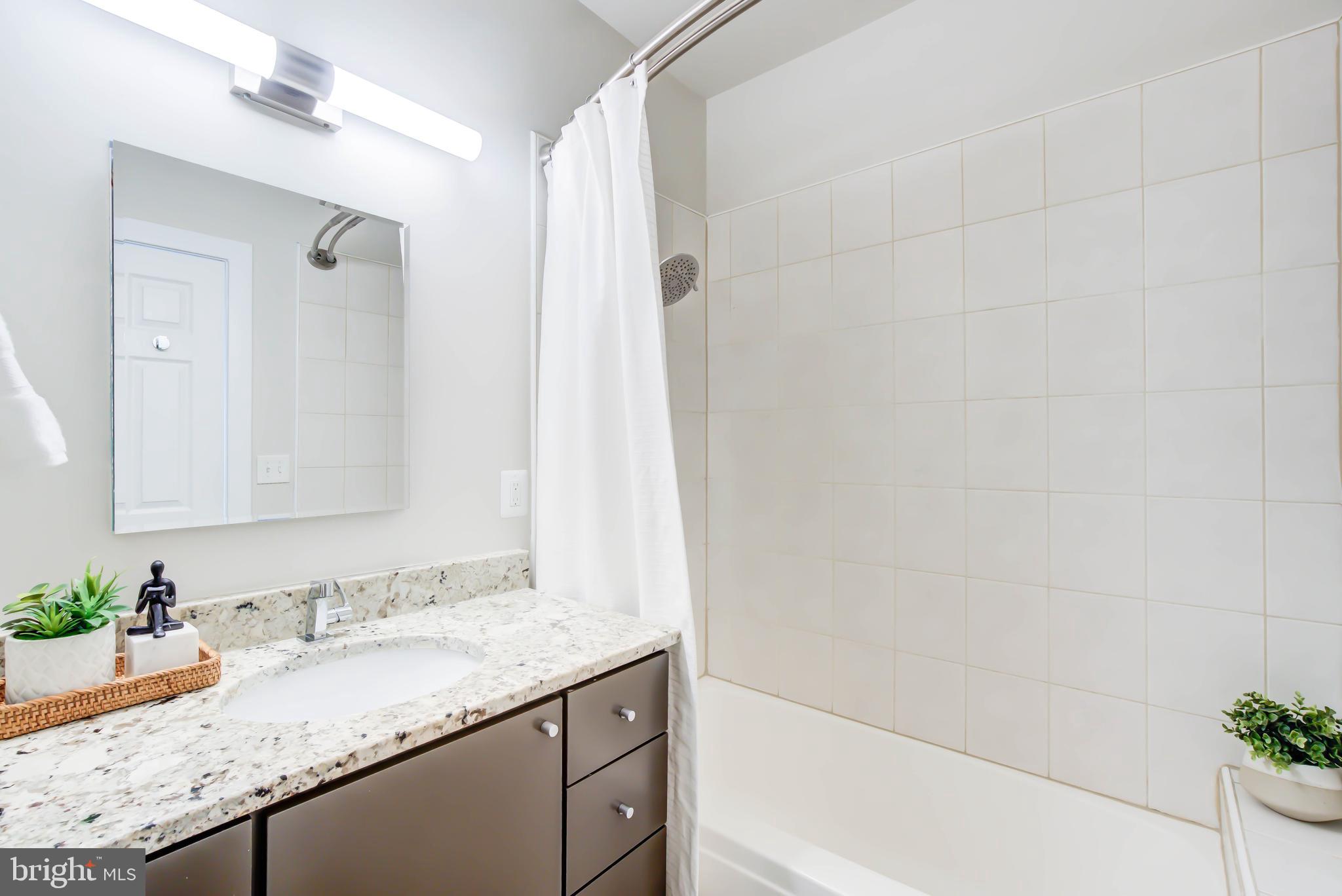 1111 Fairmont Street Northwest Washington, DC 20009 - Photo 27 of 55 Primary Bath w Custom Vanity and Tub/Shower