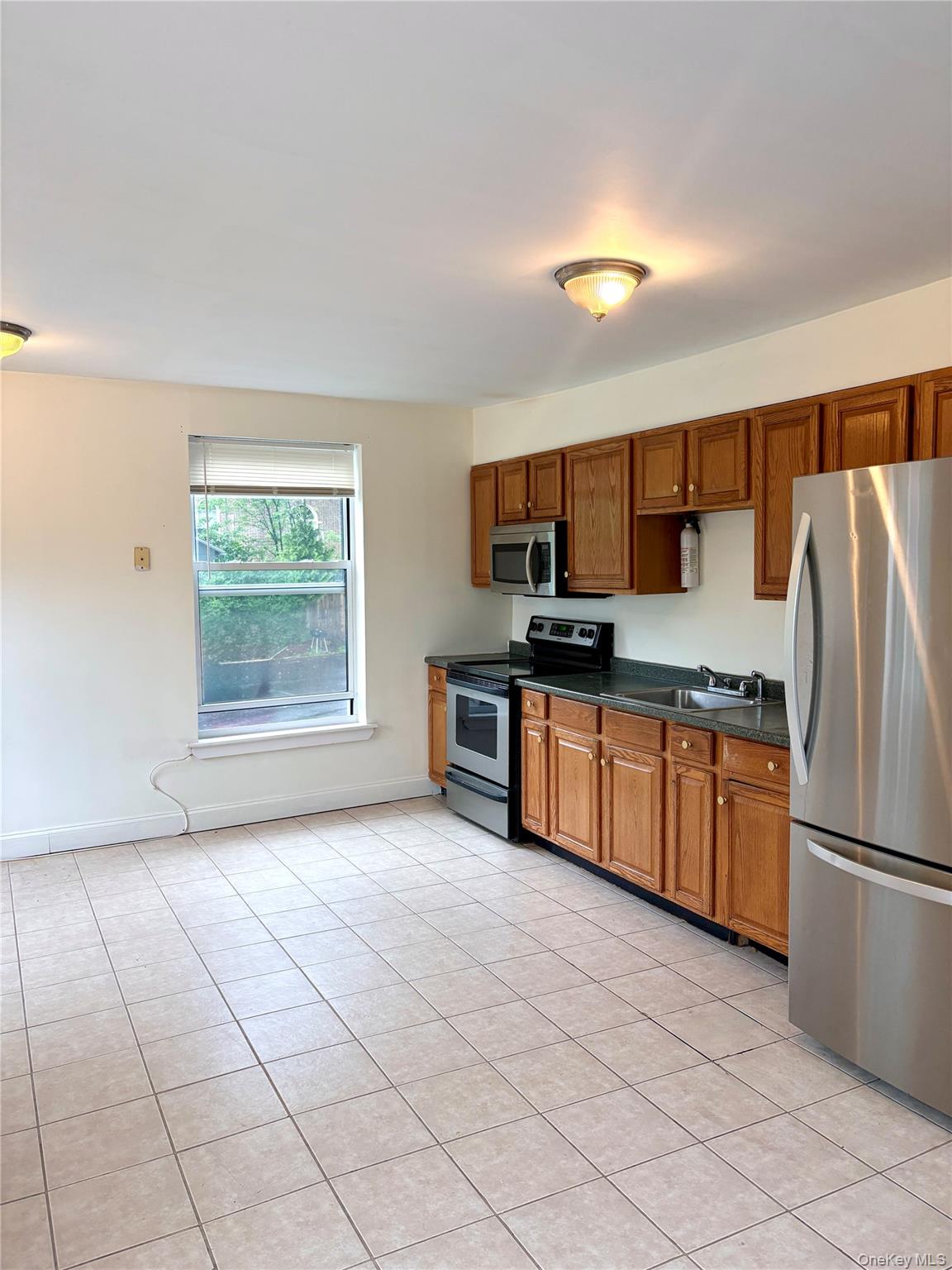 2 Morris Avenue, Unit 203 Cold Spring, NY 10516 - Photo 6 of 32 a kitchen with stainless steel appliances a refrigerator sink and microwave