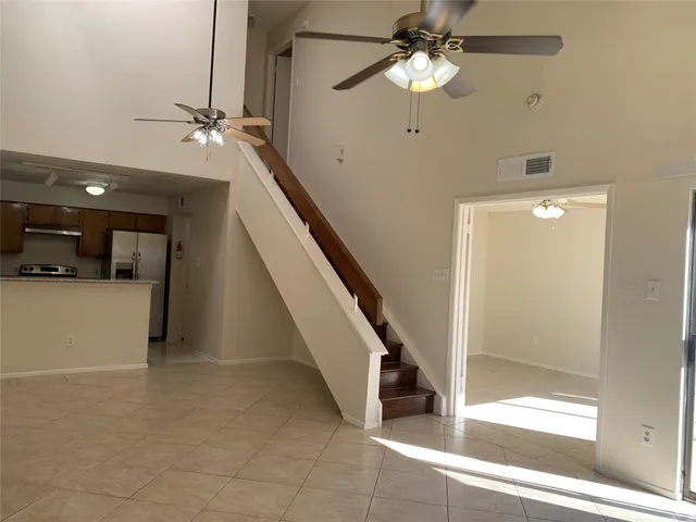 a view of a hallway view with staircase