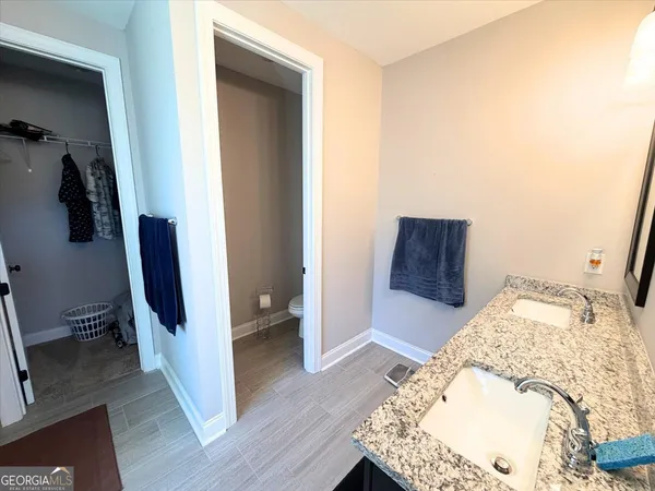 a view of bedroom with wooden floor