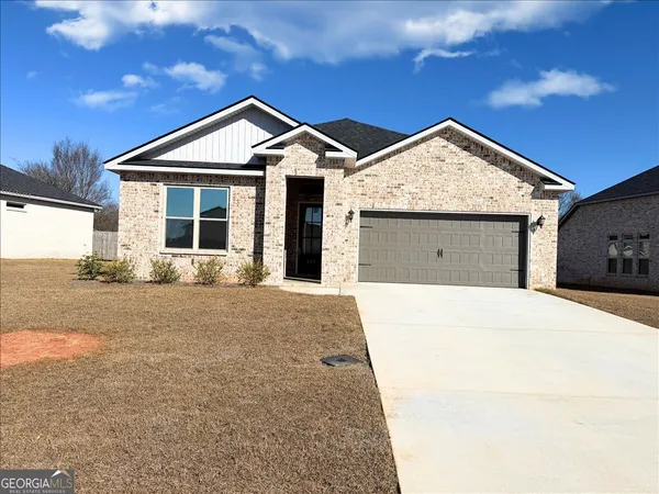 a front view of a house with yard