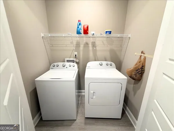 a utility room with dryer and washer