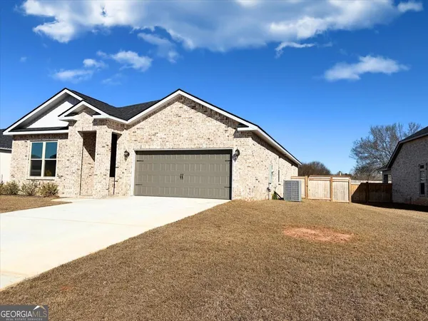 a front view of a house with a yard