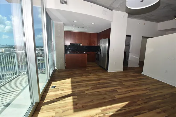 a view of a hallway view with wooden floor and staircase