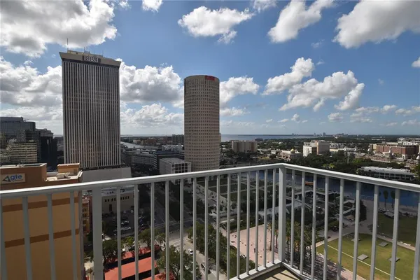 a view of a balcony with city view