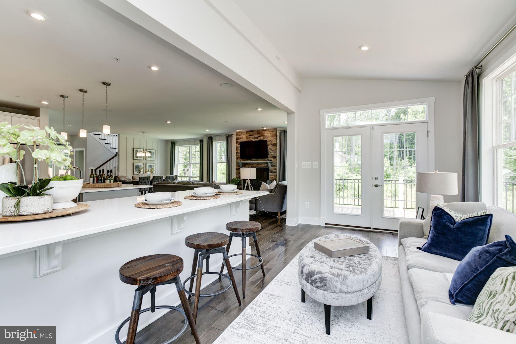1713 Copperleaf Boulevard Hanover, MD 21076 - Photo 16 of 48 a living room with furniture and a large window