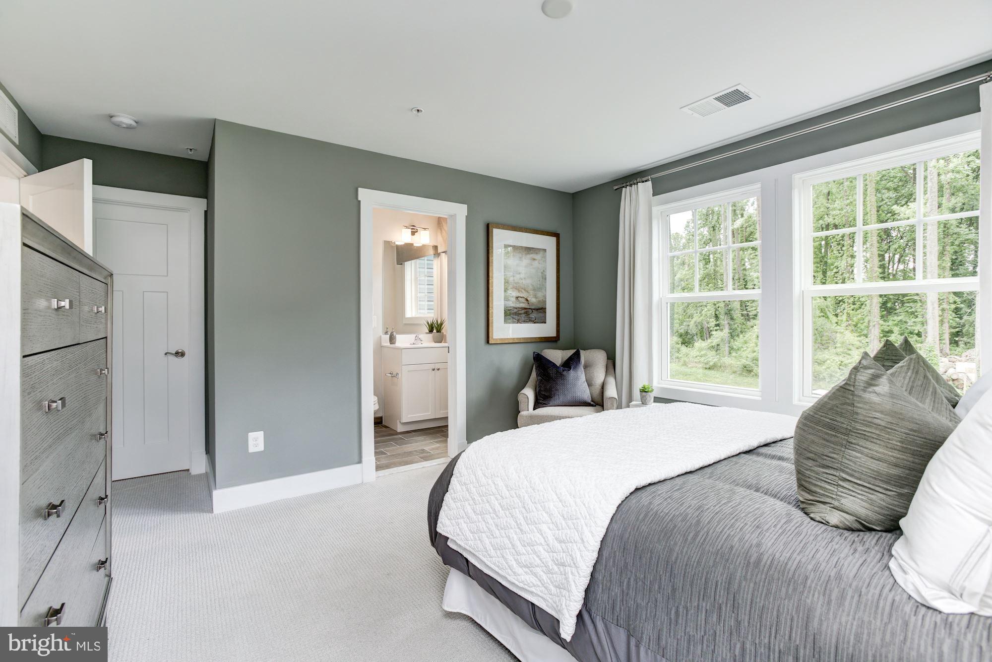 1713 Copperleaf Boulevard Hanover, MD 21076 - Photo 30 of 48 a bedroom with a large bed and a large window