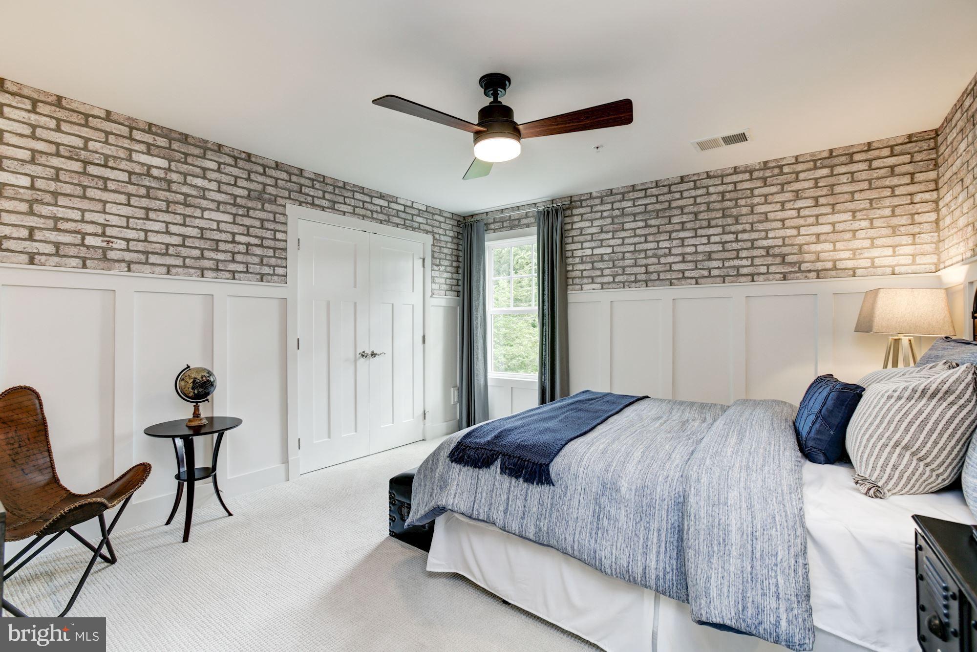 1713 Copperleaf Boulevard Hanover, MD 21076 - Photo 34 of 48 a bedroom with a bed and a chandelier